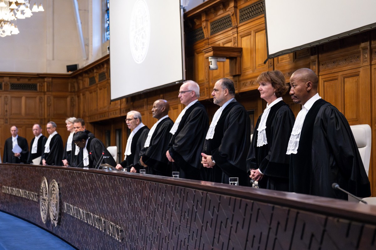 (From R) Judge Dire Tladi, Judge Sarah Cleveland, Judge Leonardo Nemer Caldeira Brant, Judge Georg Nolte, Judge Abdulqawi Ahmed Yusuf, Judge Nawaf Salam rise during a hearing at the International Court of Justice (ICJ) as part of South Africa's request on a Gaza ceasefire in The Hague, on May 24, 2024, amid the ongoing conflict between Israel and the Hamas movement. - International Court of Justice (ICJ) orders Israel to 'immediately halt' offensive in Rafah, as part of South Africa's request on a Gaza ceasefire in The Hague, on May 24, 2024. (Photo by Nick Gammon / AFP)