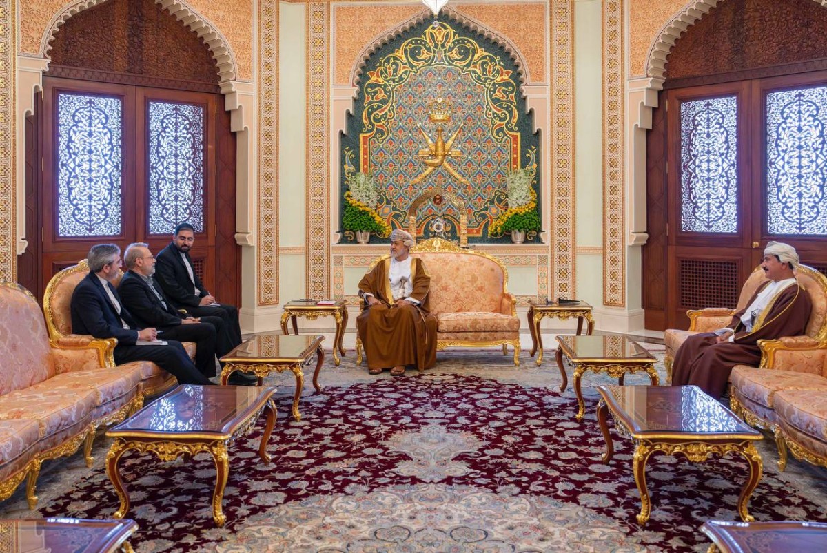 This photo released by Iran's Supreme National Security Council office shows Secretary of the Supreme National Security Council Ali Larijani (2nd L) meeting with The Sultan of Oman, Haitham bin Tariq (2nd R) while Oman's Minister of the Royal Office Sultan bin Mohammed al-Numani (R) looks on in Muscat, Oman on February 10, 2026. Iran's top security official met Oman's ruler in Muscat on February 10, days after a new round of talks there between officials from Washington and Tehran. Ali Larijani, who heads the Supreme National Security Council, and Sultan Haitham bin Tariq "discussed the latest developments in the Iranian-American negotiations", the official Oman News Agency said. (Photo by HANDOUT / Iran's Supreme National Security / AFP)