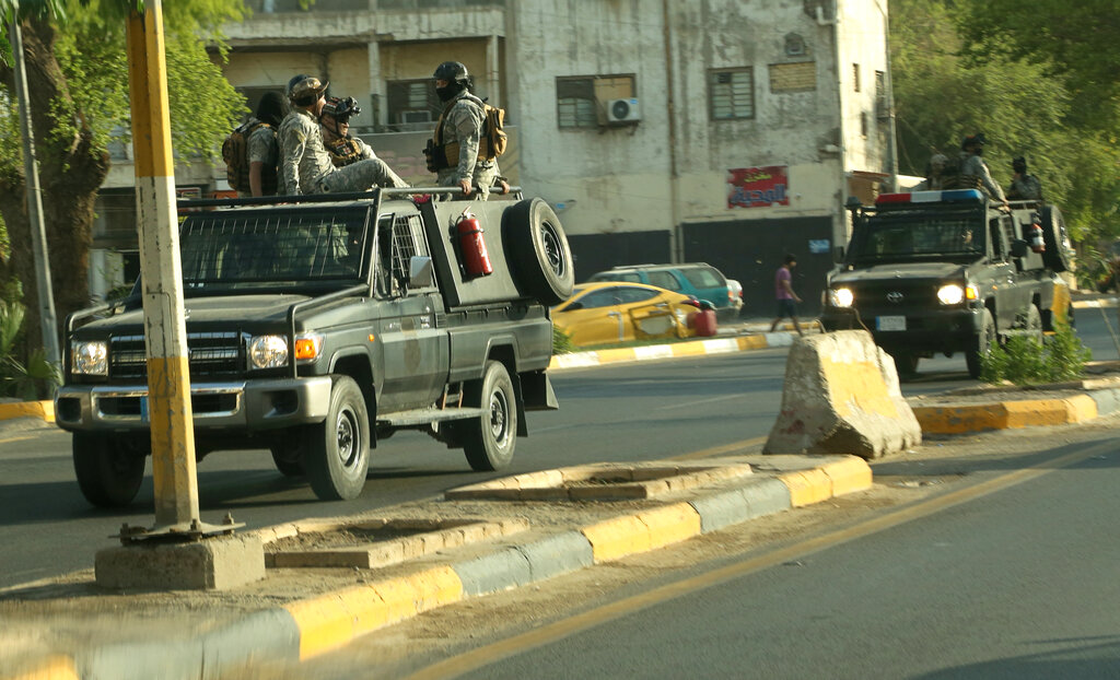 Popular Mobilization Forces, PMF, patrol outside the heavily fortified Green Zone, where the Prime Minister's headquarters is in Baghdad, Iraq, Wednesday, May 26, 2021. Photo: AP 