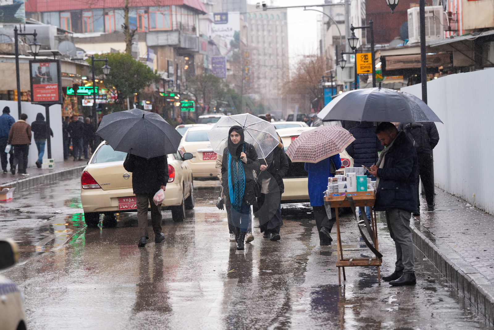 Residents carry on with errands and work in the Kurdistan Region despite rainy weather in February 2024. (Hama Sur/Channel8) 