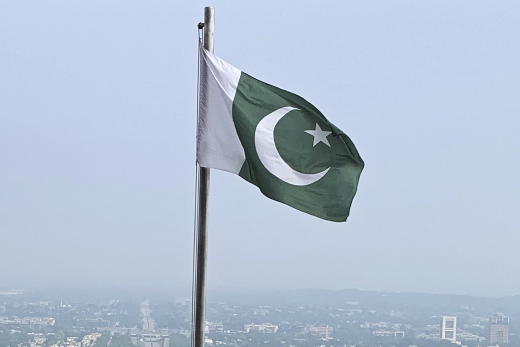 A Pakistani flag flies on a lookout in Islamabad, Pakistan, on July 27, 2022. (AP Photo/Rahmat Gul, File)