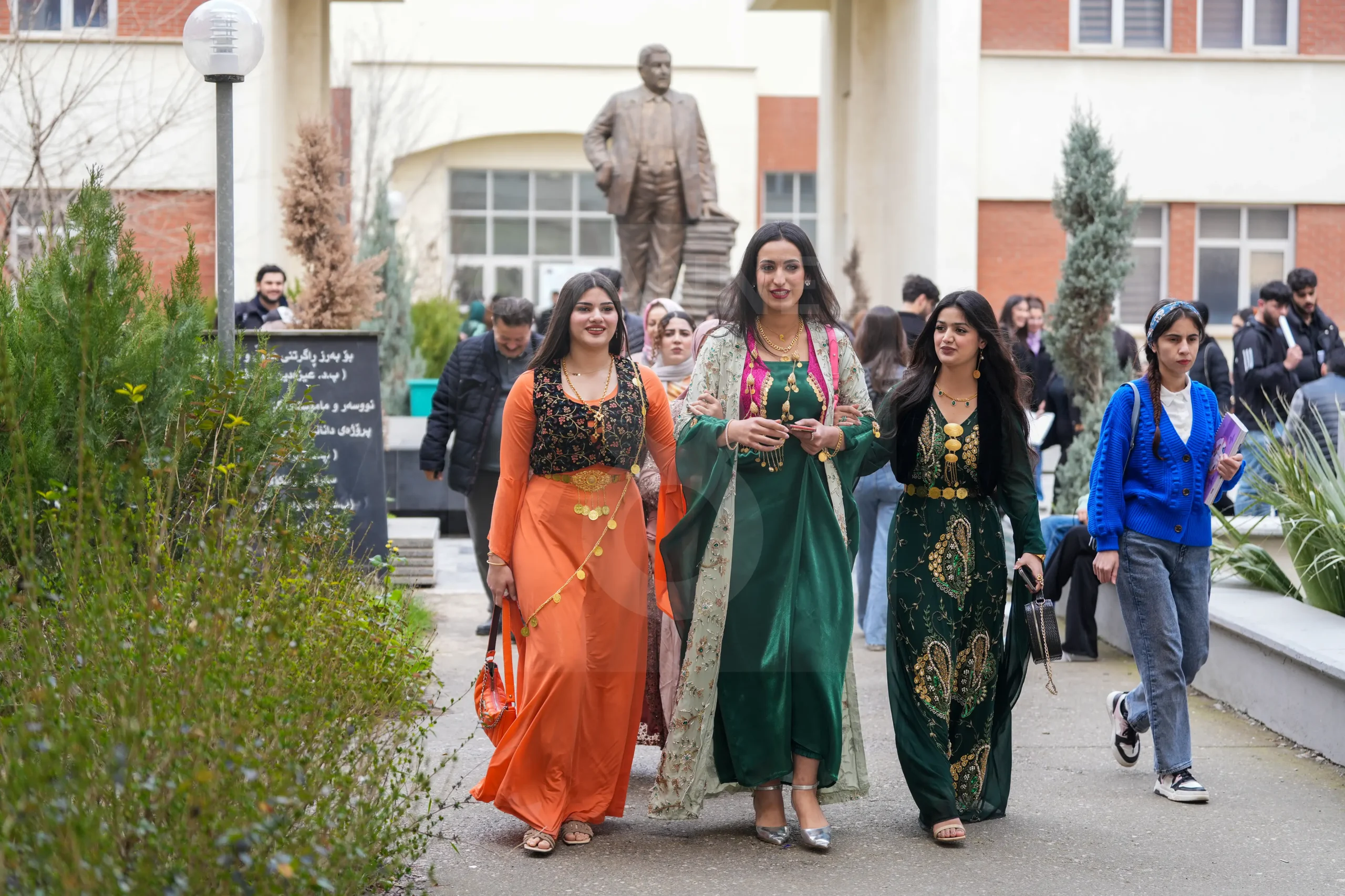 Three women are seen wearing Kurdish clothes at the university. (Photo: Hama Sur/Channel8)