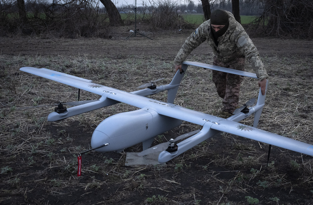A Ukrainian soldier of 22nd Mechanised brigade prepares to start the Poseidon H10 Middle-range UAV at the front-line, near Bakhmut, Donetsk region, Ukraine,Tuesday, March 26, 2024. (AP Photo/Efrem Lukatsky)