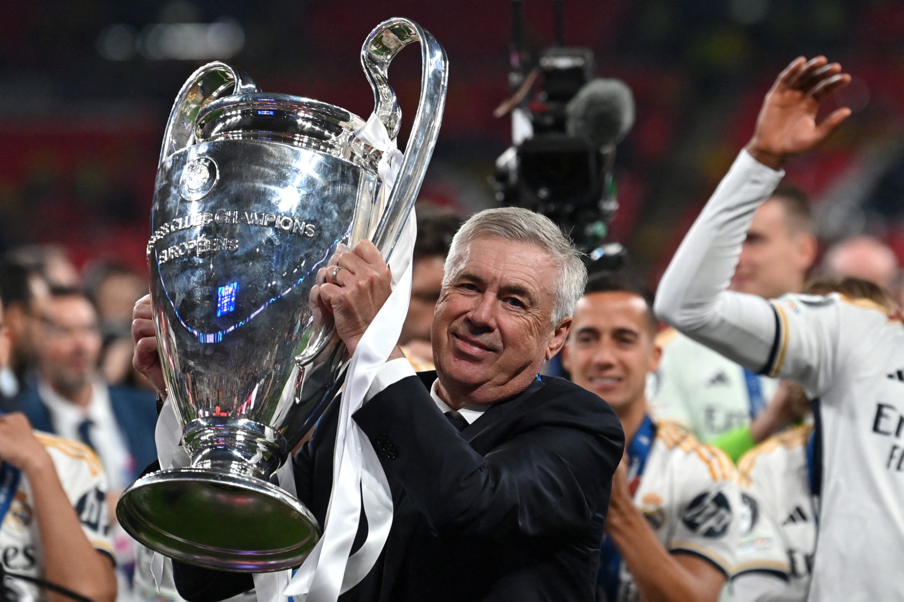 Real Madrid's Italian coach Carlo Ancelotti lifts the trophy to celebrate the victory at the end of the UEFA Champions League final football match between Borussia Dortmund and Real Madrid, at Wembley stadium, in London, on June 1, 2024. Photo: AFP