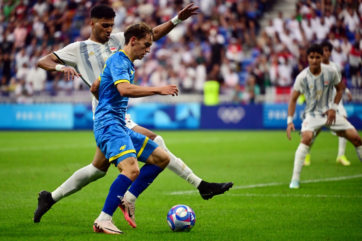 Iraq's defender #06 Zaid Tahseen challenges Ukraine's midfielder #17 Oleh Fedor in the men's group B football match between Iraq and Ukraine during the Paris 2024 Olympic Games at the Lyon Stadium in Lyon on July 24, 2024. Photo: AFP 