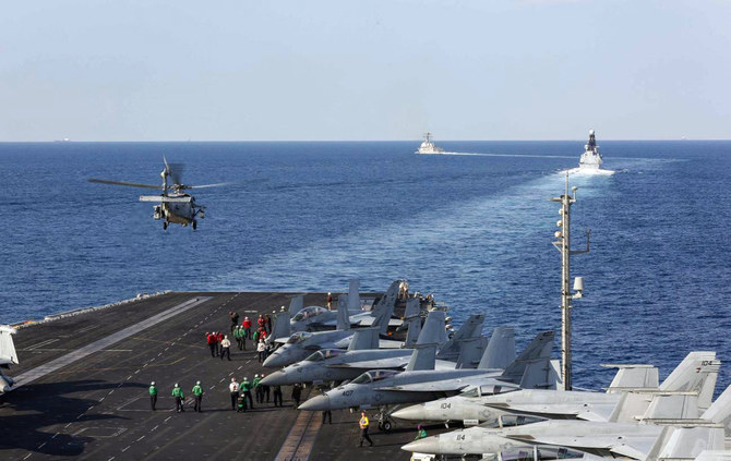 This photo taken on November 19, 2019 shows the US Navy's aircraft carrier strike group Abraham Lincoln transiting the Strait of Hormuz. The carrier group is on its way to the Middle East again to relieve another carrier group. (AFP/File)
