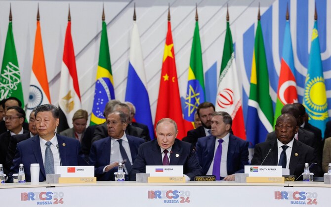 Officials, including South Africa's President Cyril Ramaphosa, Russia's President Vladimir Putin and China's President Xi Jinping, attend a plenary session in the outreach/BRICS Plus format at the BRICS summit in Kazan on October 24, 2024. (Photo by Maxim Shemetov / POOL / AFP)