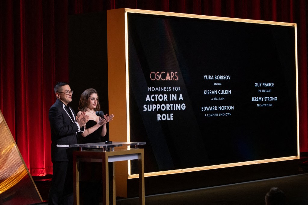 In this handout photo provided by The Academy, (L-R) Bowen Yang and Rachel Sennott present the nominees for Actor in a Supporting Role onstage during the 97th Oscars Nominations Announcement at Samuel Goldwyn Theater on January 23, 2025 in Beverly Hills, California. Al Seib/The Academy via /AFP 