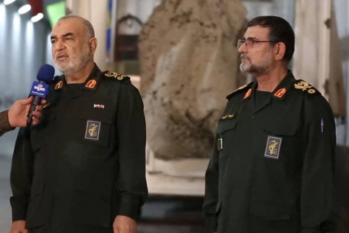IRGC commander-in-chief Major General Hossein Salami (L) alongside navy commander Admiral Alireza Tangsiri talking to a reporter during the unveiling of the Qadr-380 naval cruise missile in an undisclosed location in Iran. The naval arm of Iran's Revolutionary Guards unveiled a new underground missile facility on the south coast in footage aired by state television on February 1. (Photo by SEPAH NEWS / AFP)
