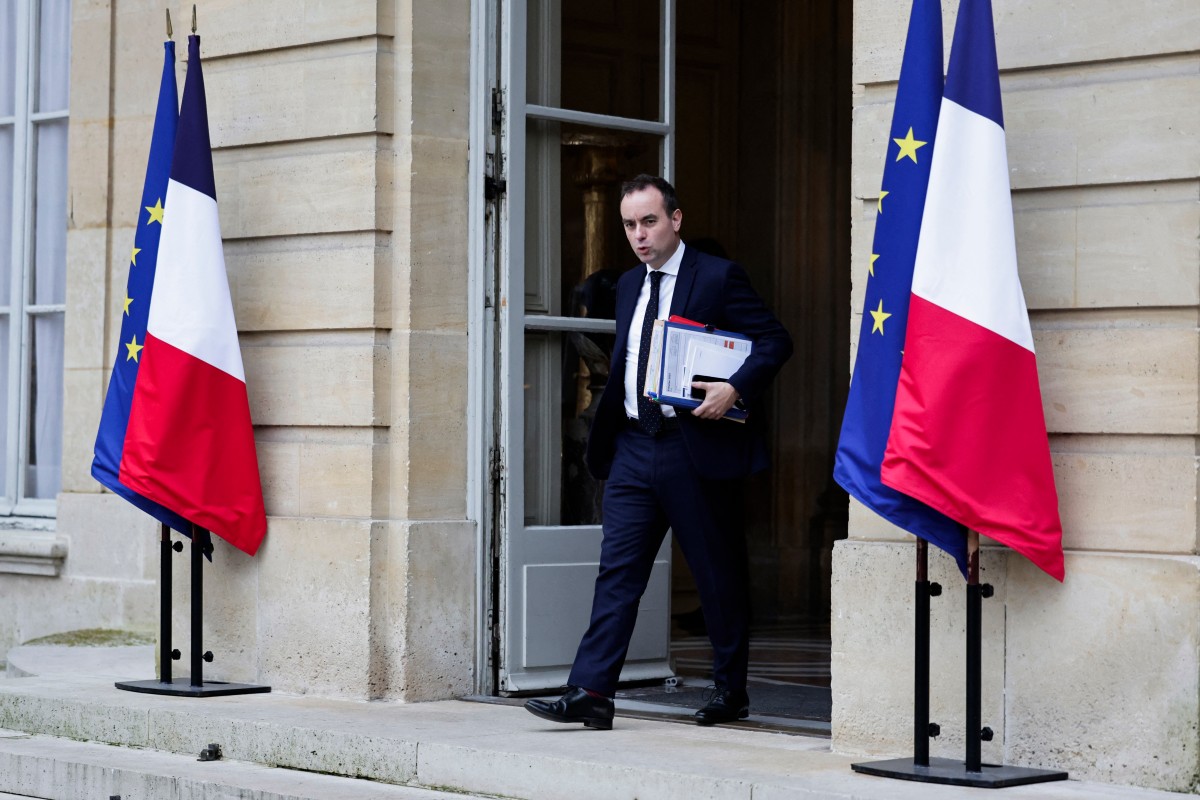 French Minister of Armed Forces Sebastien Lecornu leaves after an interministerial Committee on Artificial Intelligence at Hotel Matignon in Paris on February 6, 2025. (Photo by STEPHANE DE SAKUTIN / AFP)