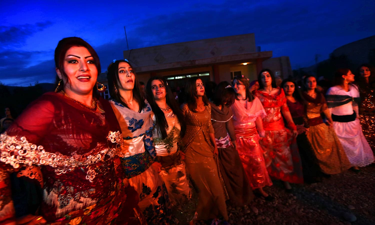 Kurdish women perform a traditional dance to mark Newroz in East Kurdistan. Photo: AFP