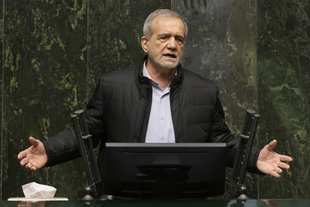 Iran's President Masoud Pezeshkian addresses members of parliament in Tehran on March 2, 2025, during impeachment proceedings against the country's finance minister. Parliament is expected to vote on the impeachment in the afternoon on March 2, with any dismissal requiring the backing of a majority of the 290-seat body. (Photo by ATTA KENARE / AFP)