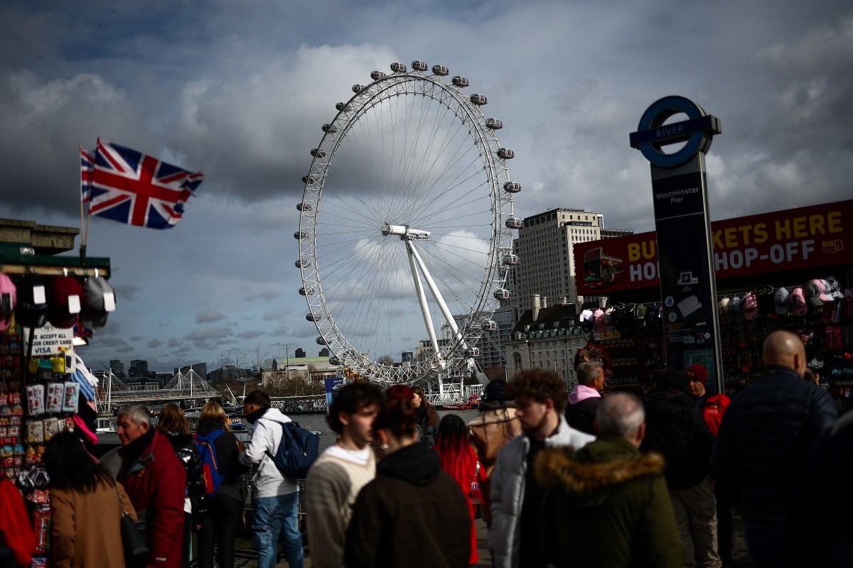 Floating high above the London skyline aboard her most famous creation, architect Julia Barfield said she never expected the London Eye to take off as a design icon. (Photo by HENRY NICHOLLS / AFP)
