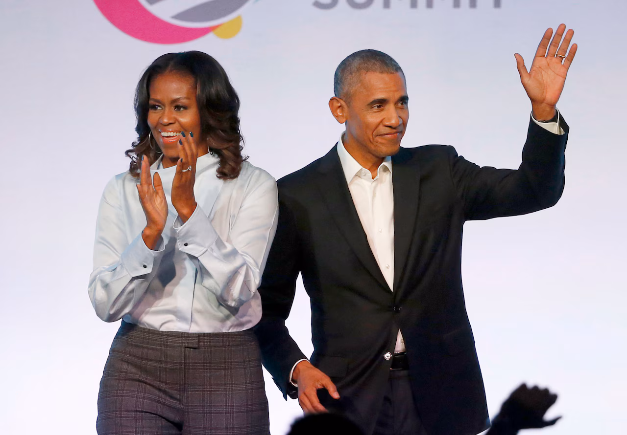 Former President Barack Obama, right, and former first lady Michelle Obama appear at the Obama Foundation Summit in Chicago in 2017. (AP Photo/Charles Rex Arbogast, File)AP