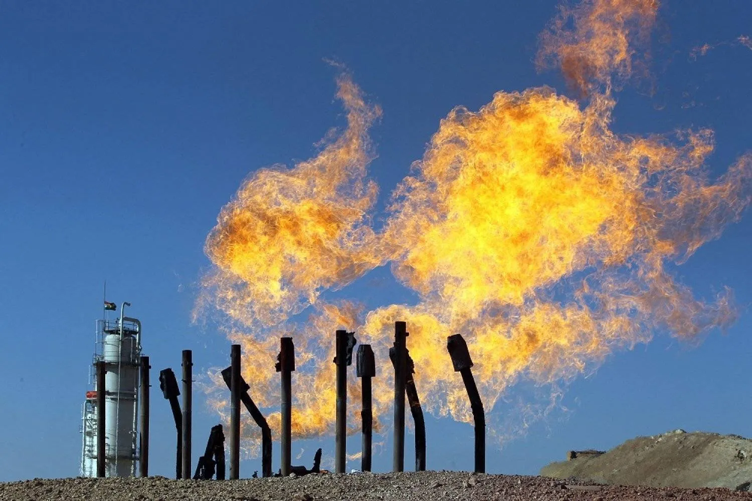 Flammable gases burning from gas flares at the Havana oil field, west of Kirkuk. Photo: AFP