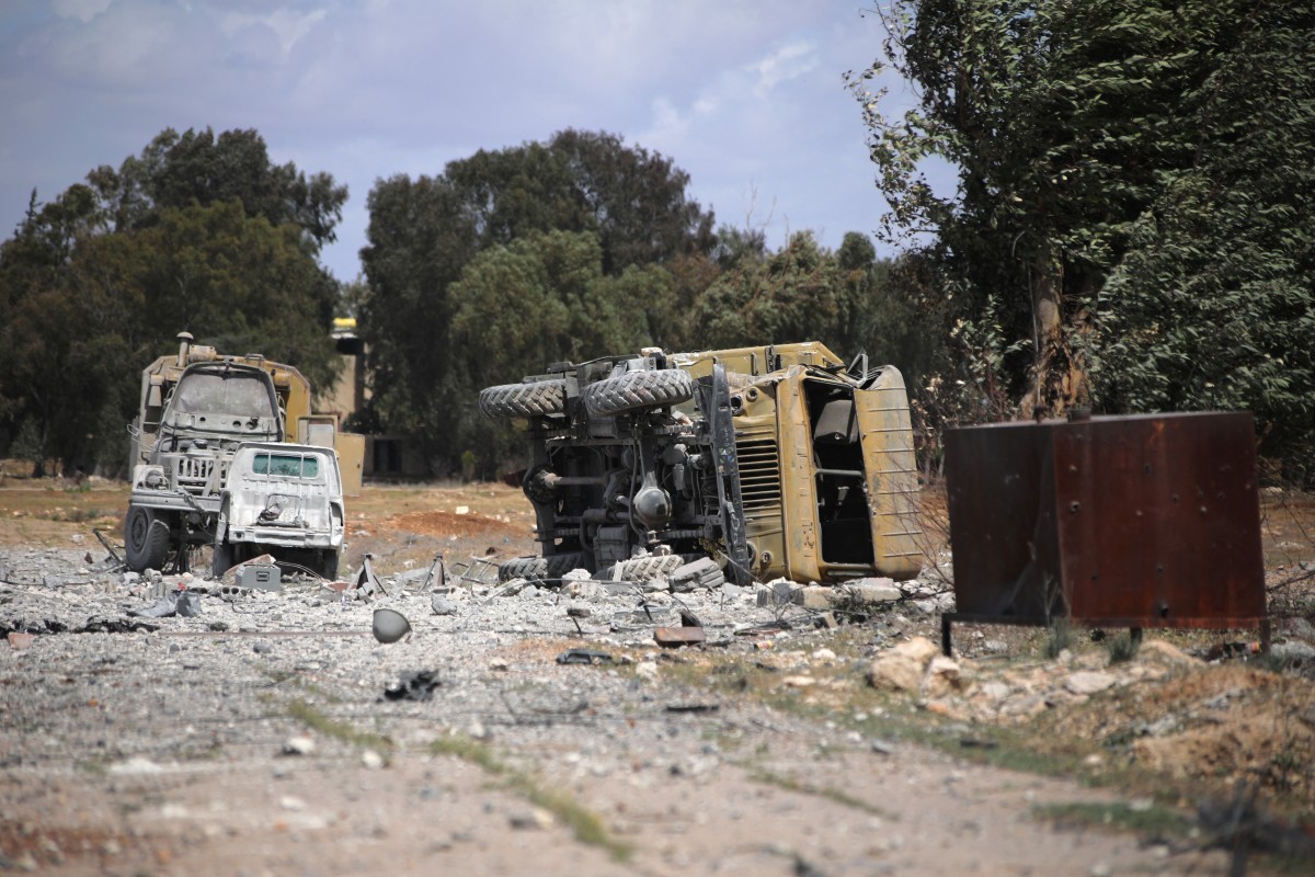 Debris and military vehicles lie at the scene of an Israeli strike in Syria's southern Hama governorate, on April 3, 2025. Israel has carried out an extensive bombing campaign against Syrian military assets since Islamist-led rebels toppled longtime strongman Bashar al-Assad in November 2024. It has also carried out ground incursions into southern Syria in a bid to keep the forces of the new government back from the border. (Photo by Abdulaziz KETAZ / AFP)