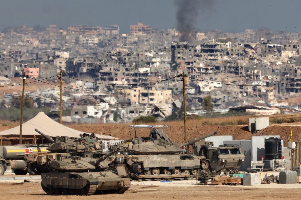 Israeli troops deploy at a position by Israel's border with the Gaza Strip on May 20, 2025. Israel's military has announced the expansion of its operations, saying it is aimed at "achieving all the war's objectives" including releasing hostages and "the defeat of Hamas", the Palestinian movement that runs Gaza. (Photo by Jack GUEZ / AFP)