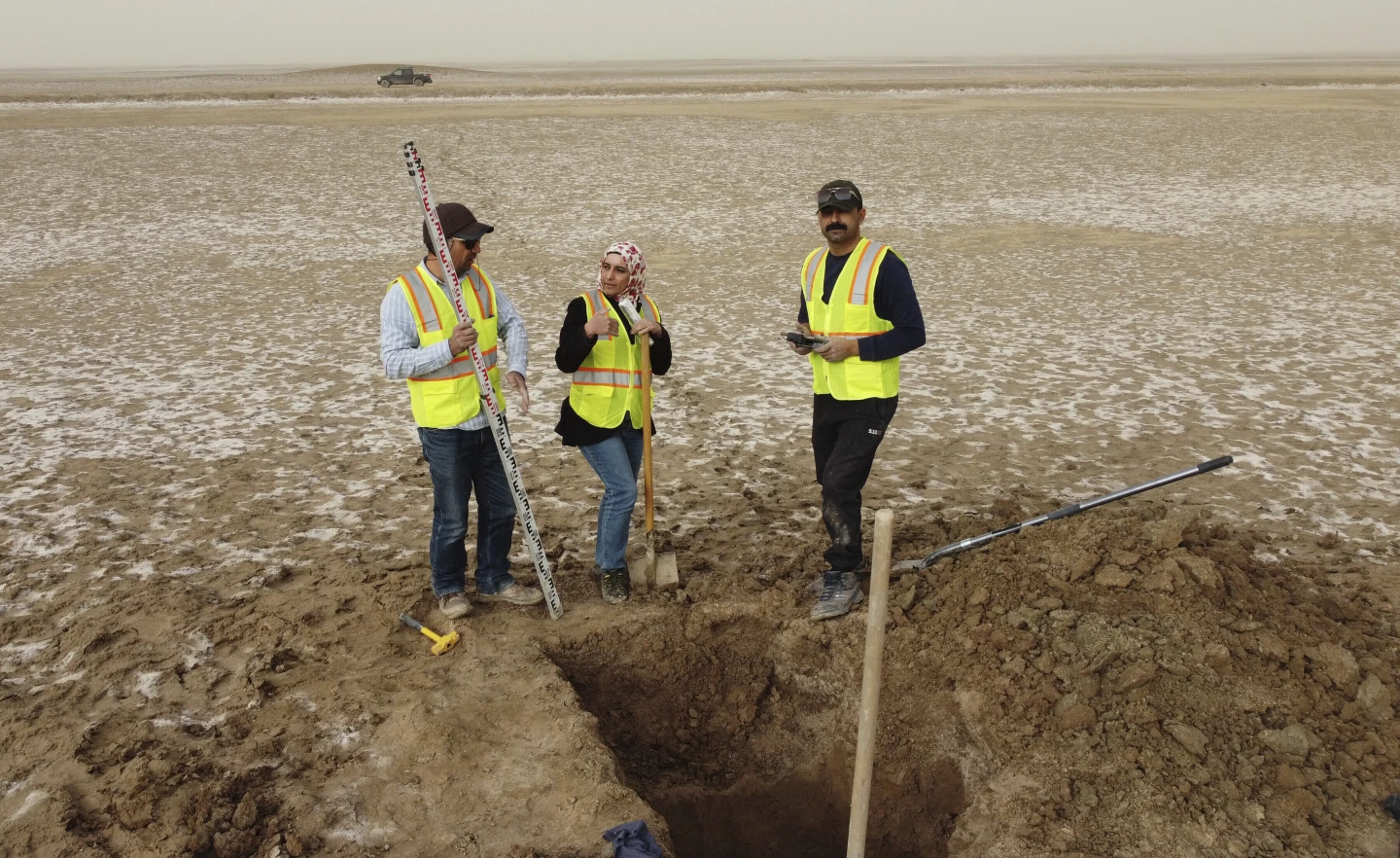 Archaeologists work at an archaeological site where researchers uncovered massive earthen structures, believed to have been built with slave labor, and found that their construction spanned several centuries, near Basra, Iraq, Friday, Jan. 28, 2022. (AP Photo/Jaafar Jotheri)

