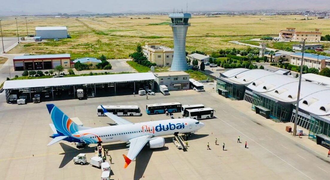 The image shows an aerial view of a Flydubai airplane at Sulaymaniyah Airport. Photo: Sulaymaniyah International Airport
