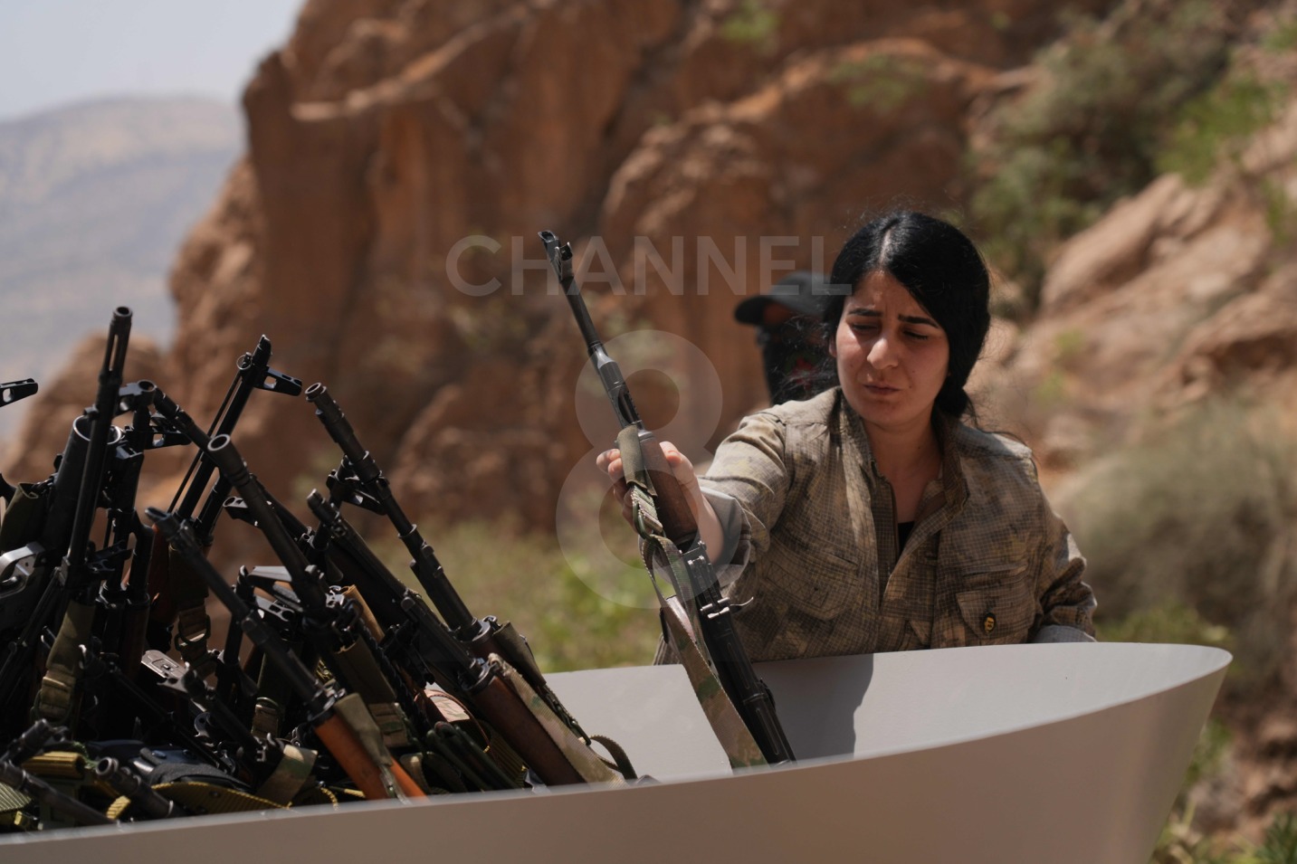 Thirty PKK fighters burned their weapons in a ceremony in Sulaymaniyah on July 11, 2025, as part of their disarmament process. Photo: Hama Sur / Channel8