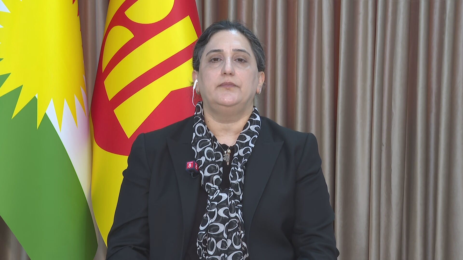 Ashwaq Jaf, member of the KDP Central Committee, speaks during an interview with Channel8. Photo: Channel8


