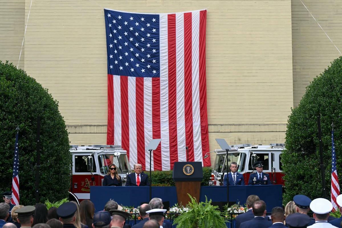 (L-R) First Lady Melania Trump, US President Donald Trump, US Secretary of Defense Pete Hegseth and US Chairman of the Joint Chiefs of Staff Air Force Gen. Dan Caine attend a 9/11 observance ceremony at the National 9/11 Pentagon Memorial in Washington, DC on September 11, 2025. (Photo by SAUL LOEB / AFP)