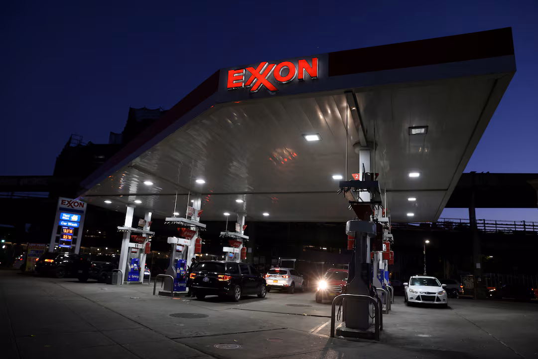 Cars are seen at an Exxon gas station in Brooklyn, New York City, U.S., November 23, 2021. REUTERS