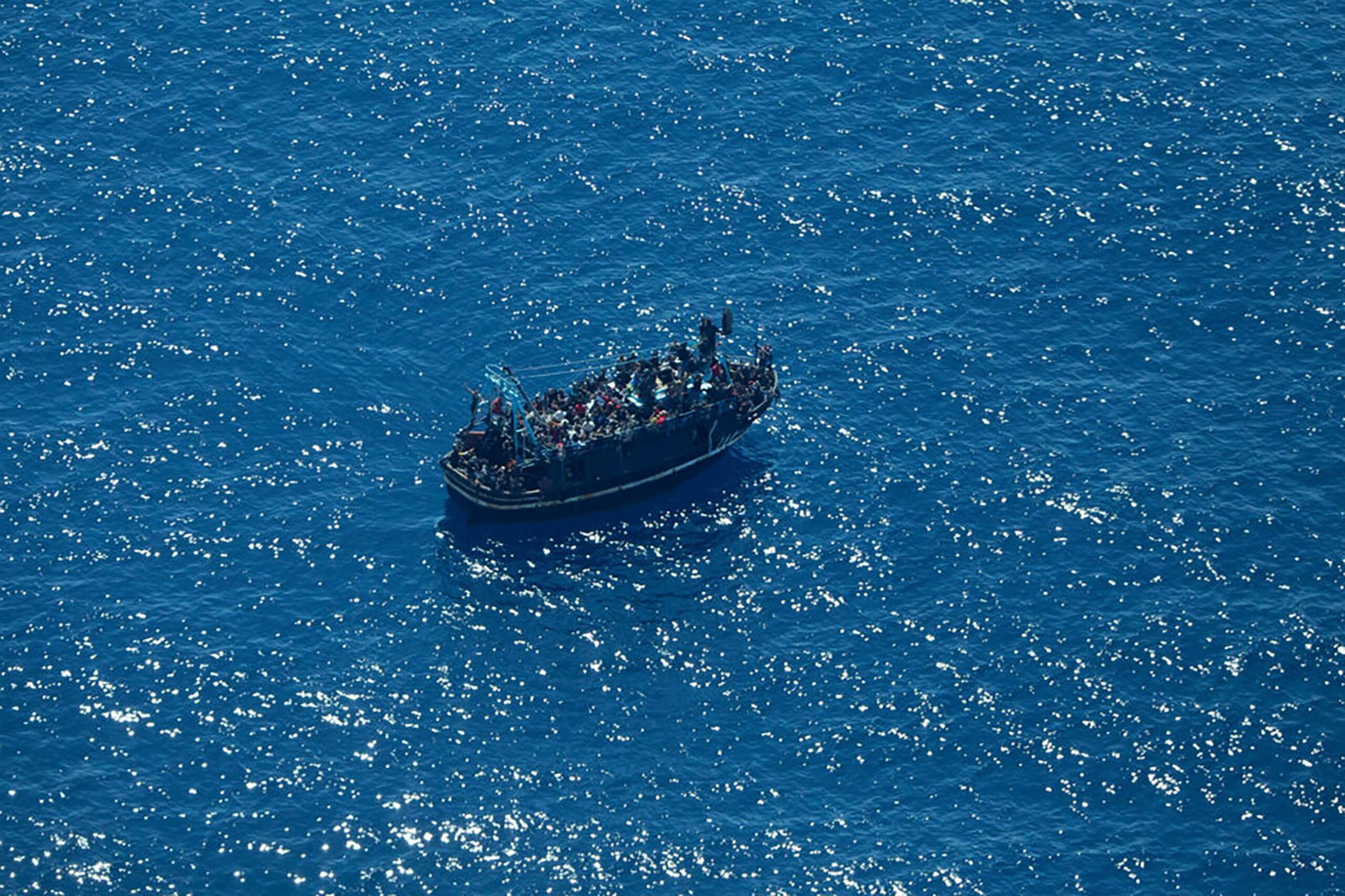 A boat in distress with some 400 people on board in the central Mediterranean, April 9, 2023. Photo: Giacomo Zorzi / Sea-Watch via AP


