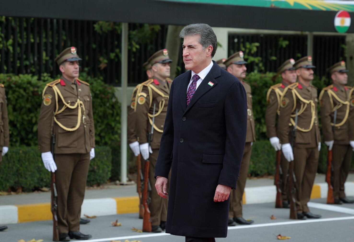 Kurdistan Region President Nechirvan Barzani raises a large Kurdistan flag, commemorating Kurdistan Flag Day on December 10, 2025. Photo: Kurdistan Region Presidency


