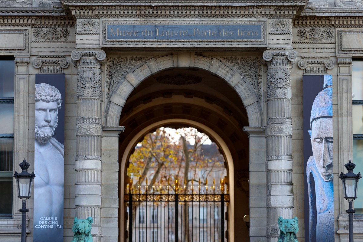 This photograph shows the "Porte des Lions", the new public entrance to the newly renovated section of the "Aile Denon" (Denon wing) of the Louvre museum, ahead of its opening to the public, in Paris, on December 2, 2025. (Photo by Ian LANGSDON / AFP)