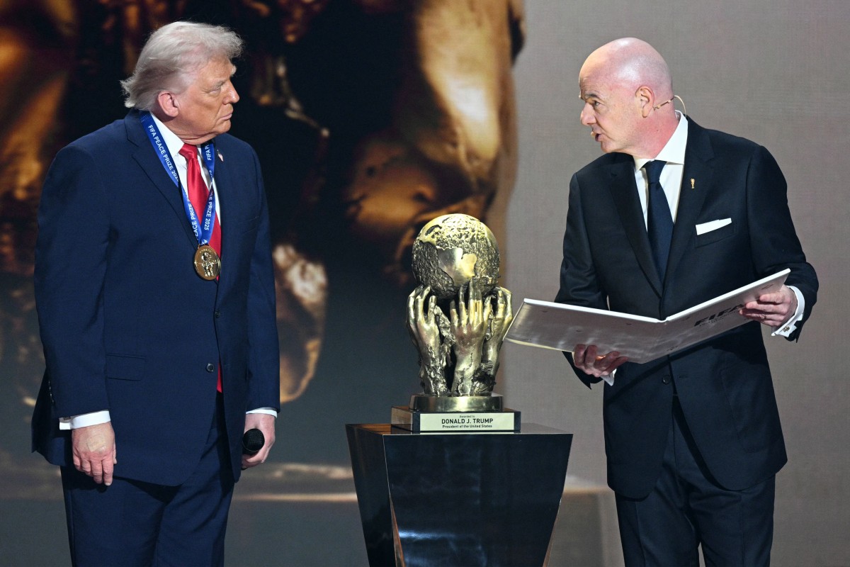 Trump receives FIFA Peace Prize from Gianni Infantino during 2026 World Cup draw in Washington, DC, Dec 5, 2025. (AFP) 