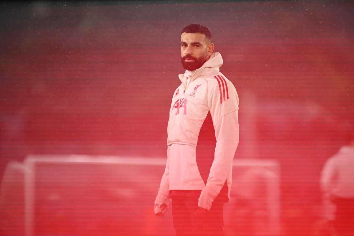 Liverpool's Egyptian striker #11 Mohamed Salah warms up ahead of the English Premier League football match between Leeds United and Liverpool at Elland Road in Leeds, northern England on December 6, 2025. (Photo by Oli SCARFF / AFP)  