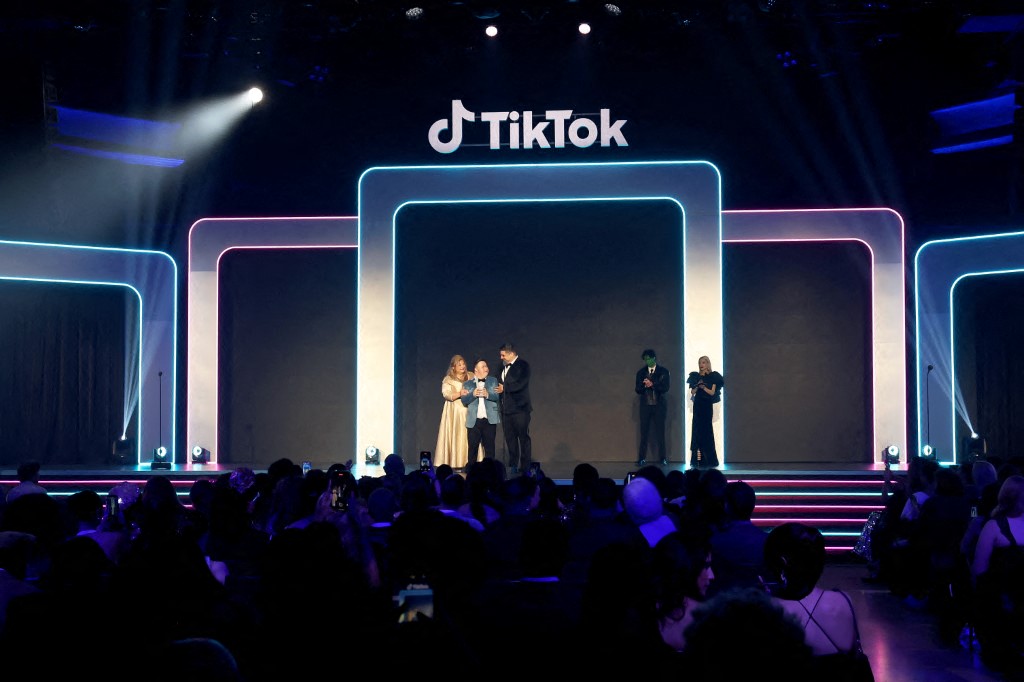 LOS ANGELES, CALIFORNIA - DECEMBER 18: (L-R) Linda Cota, Zach Valentine and Pat Valentine accept the TikTok for Good Award onstage during TikTok Awards US 2025 at Hollywood Palladium on December 18, 2025 in Los Angeles, California.   Phillip Faraone/Getty Images for TikTok/AFP  
