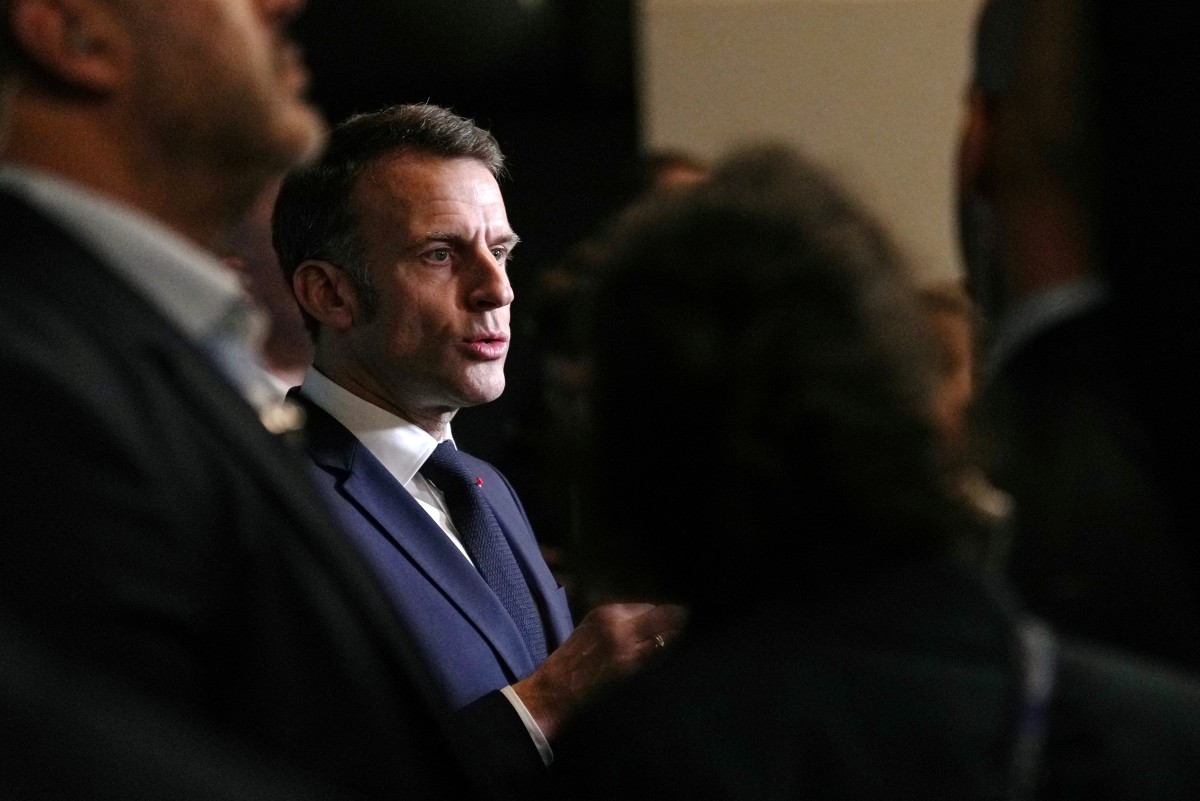 France's President Emmanuel Macron reacts as he attends the opening of the International Agriculture Fair (Salon de l'Agriculture) at Paris Expo Porte de Versailles, in Paris on February 21, 2026. (Photo by Aurelien Morissard / POOL / AFP)
