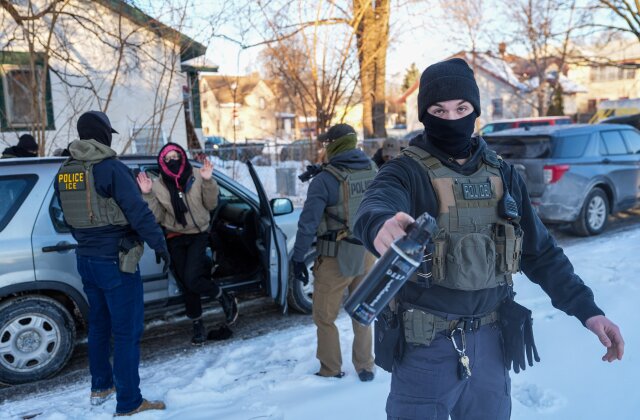 Feb. 3, 2026 | Activists are approached by federal agents in Minneapolis. (Ryan Murphy/AP)