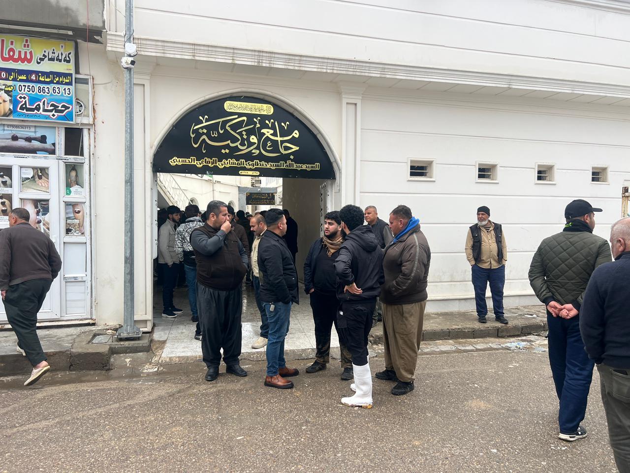 A photo of Mohammad Osman's family gathering near the mosque in Kirkuk, where his body was received."




