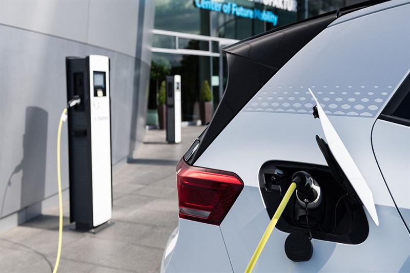 An electric car plugged into a charger. Photo: AFP



