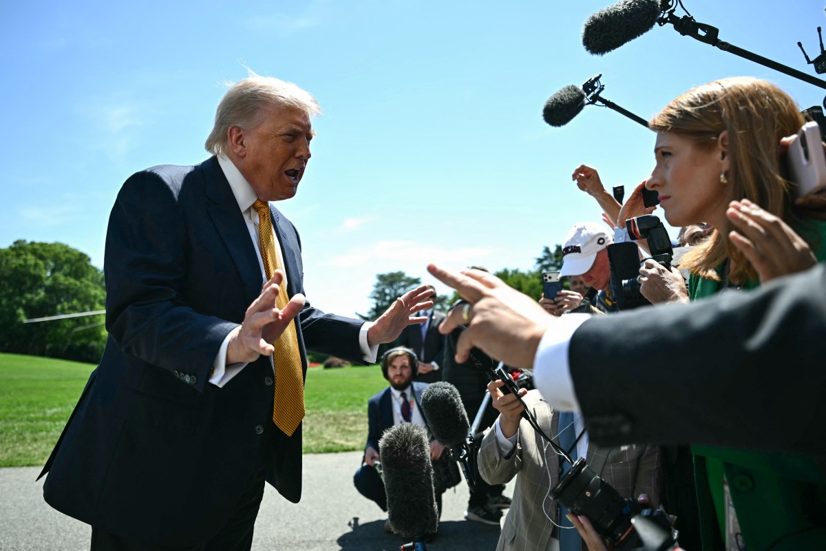 US President Donald Trump speaks to the press before walking to board Marine One as he departs from the South Lawn of the White House in Washington, DC, on May 12, 2026. President Trump said Monday he was ready to discuss US arms sales to Taiwan during his visit this week to Beijing, as he suggested his personal chemistry with counterpart Xi Jinping would prevent a Chinese invasion of the island. Trump will bring along top US executives for a trip expected to focus heavily on the US president's hopes to ramp up trade. (Photo by Kent NISHIMURA / AFP)