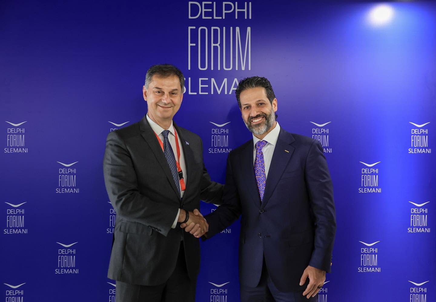 Kurdistan Region Deputy Prime Minister Qubad Talabani (right) shakes hands with Greece's Deputy Minister of Foreign Affairs, Harry Theoharis (left), on the sidelines of the second annual Delphi Forum Slemani