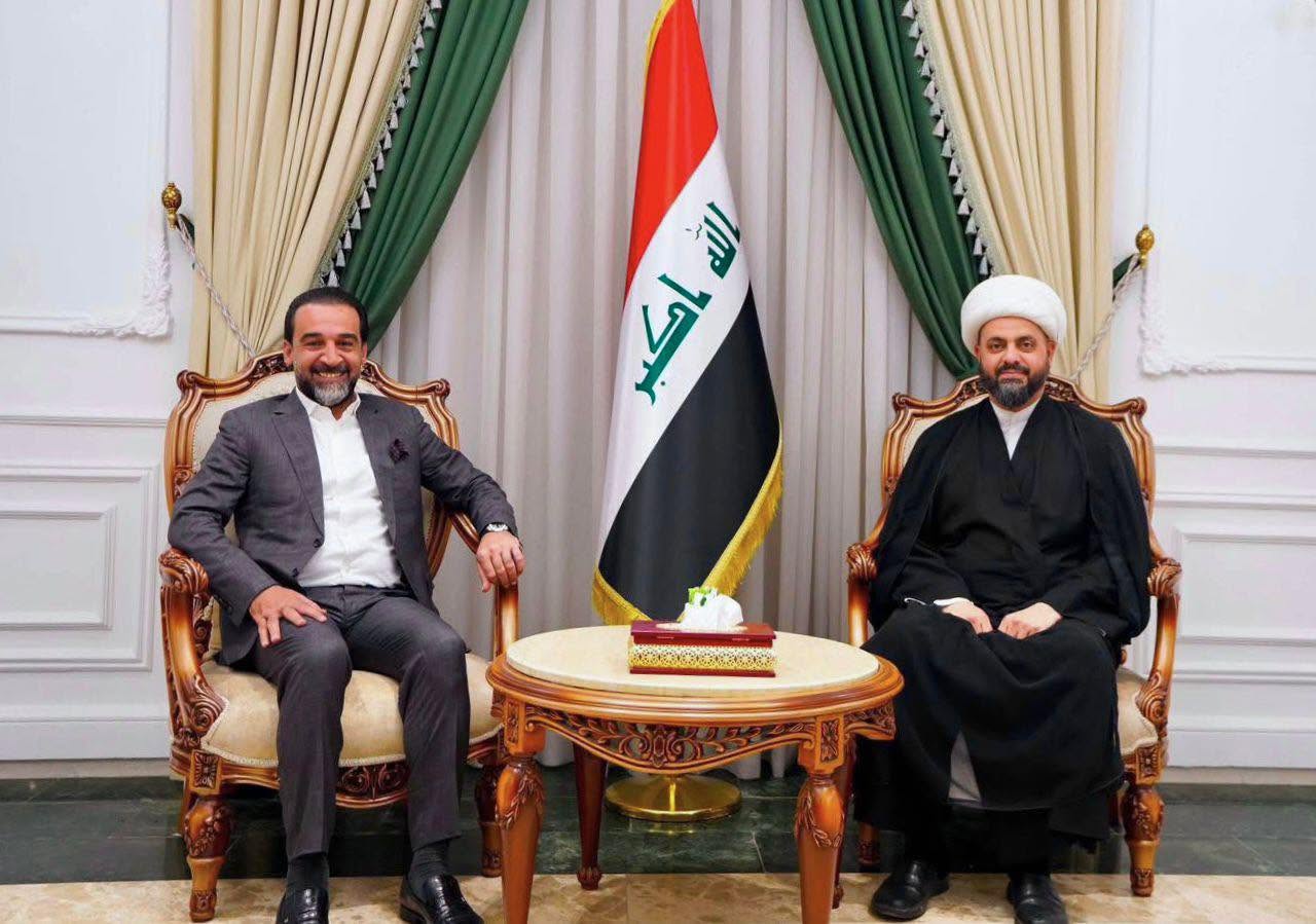 Taqadum Party leader Mohammed al-Halbousi (left) meets with the Secretary-General of the Asa'ib Ahl al-Haq movement, Sheikh Qais al-Khazali (right), in Baghdad on June 13, 2026