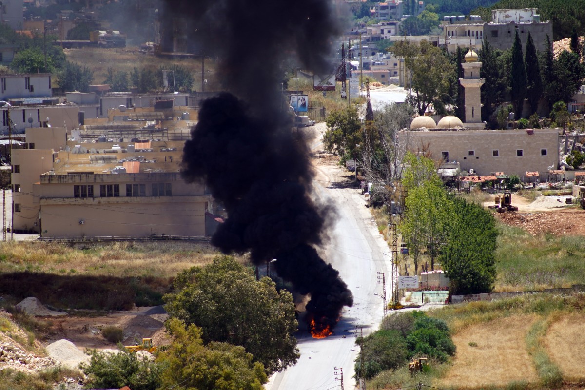 Smoke rises from a vehicle targeted by an Israeli drone attack in the southern Lebanese city of Nabatieh on June 5, 2026. Israeli strikes overnight in the south Lebanon city of Tyre killed seven people, a source from Lebanon's civil defence told AFP on June 5, despite a ceasefire in the Israel-Hezbollah war. (Photo by Abbas Fakih / AFP)