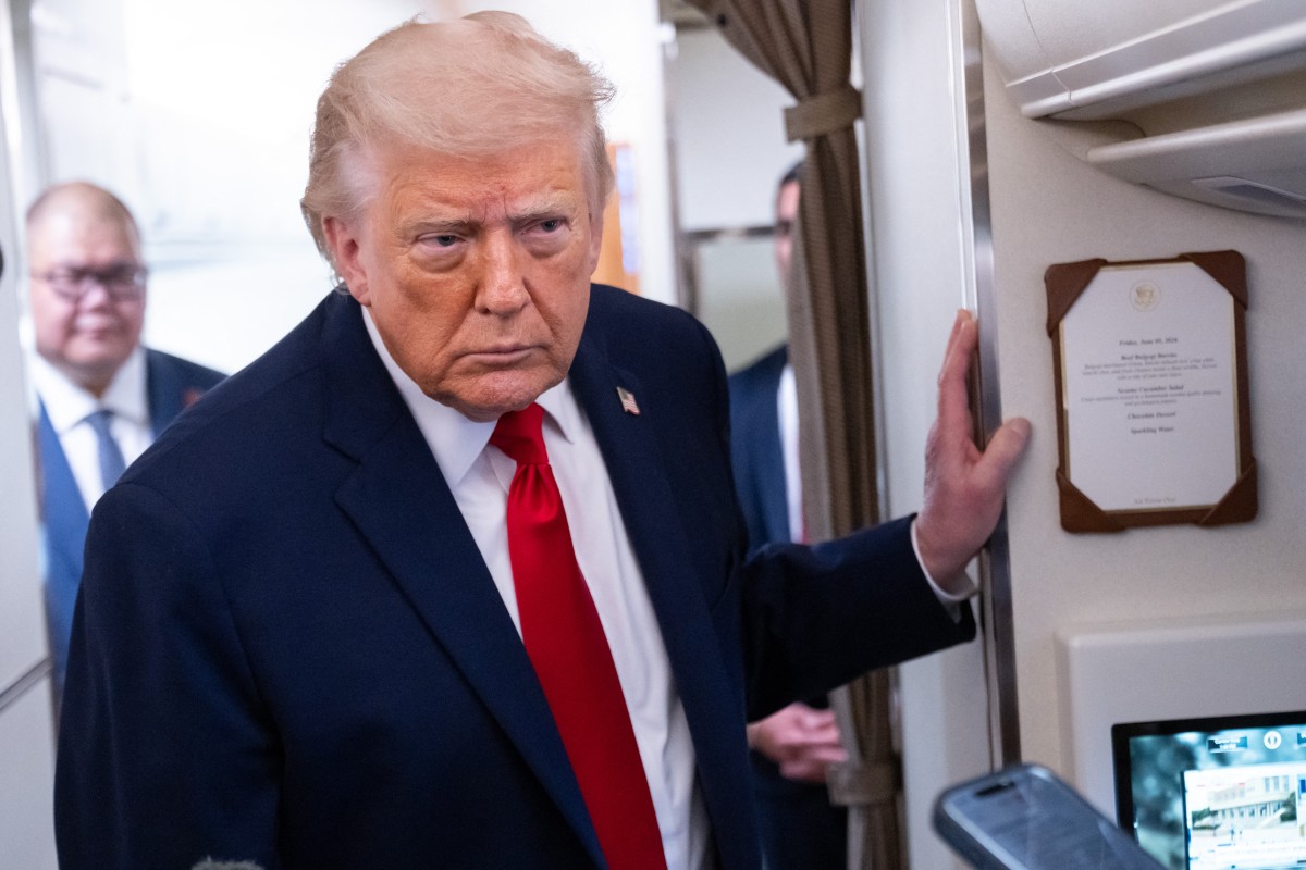US President Donald Trump speaks with the press aboard Air Force One as he flies from Joint Base Andrews in Maryland to Eau Claire, Wisconsin, June 5, 2026. Trump will participate in a rural economic roundtable on American agriculture in Chippewa Falls. (Photo by SAUL LOEB / AFP)