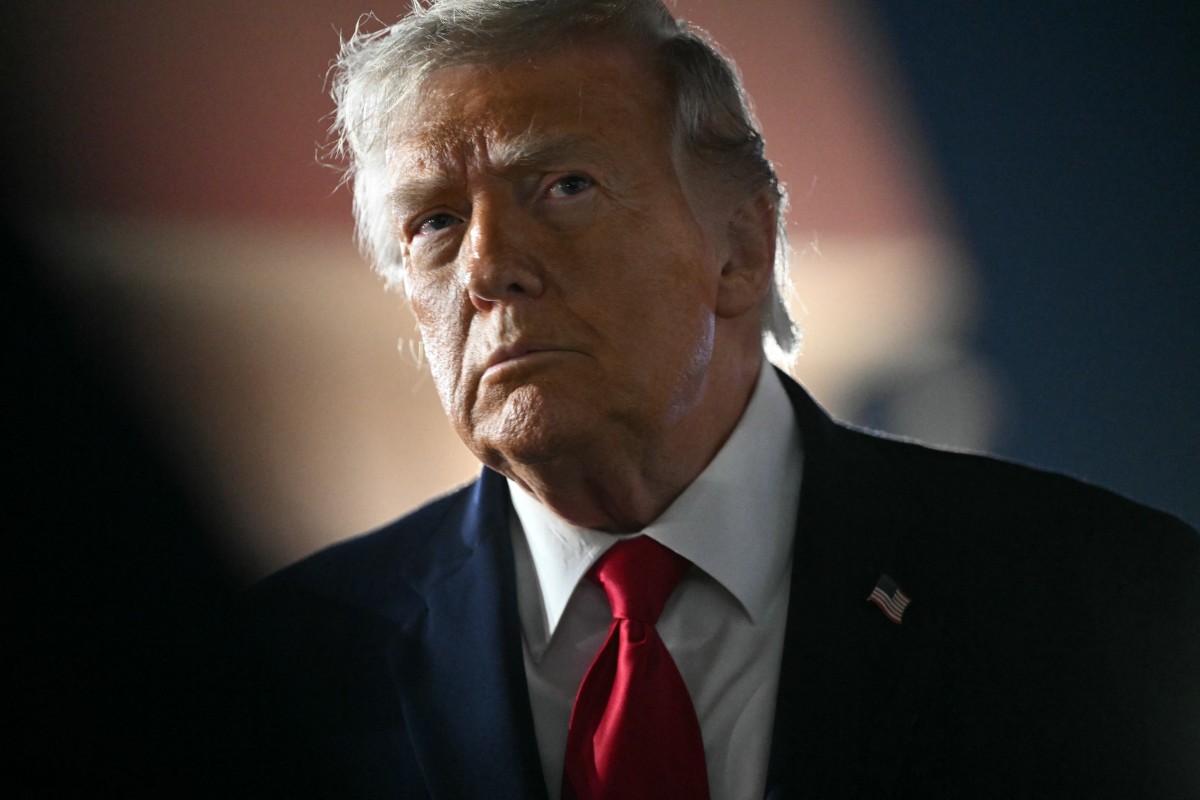 US President Donald Trump speaks to the press before boarding Air Force One prior to departure from John F. Kennedy International Airport, in New York, on June 9, 2026.  (Photo by SAUL LOEB / AFP)  