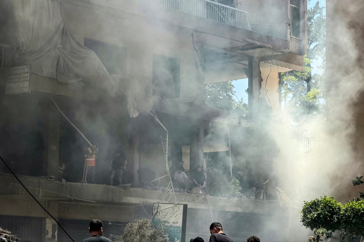 People look for survivors at the site of an Israeli airstrike that targeted a building in Beiruts southern suburbs on June 14, 2026. The office of Israeli Prime Minister Benjamin Netanyahu said on June 14 the military had carried out strikes in Beirut's southern suburbs, known as Dahiyeh, while Lebanese state media said a strike hit the Ghobeiry neighbourhood. (Photo by Ibrahim AMRO / AFP) /