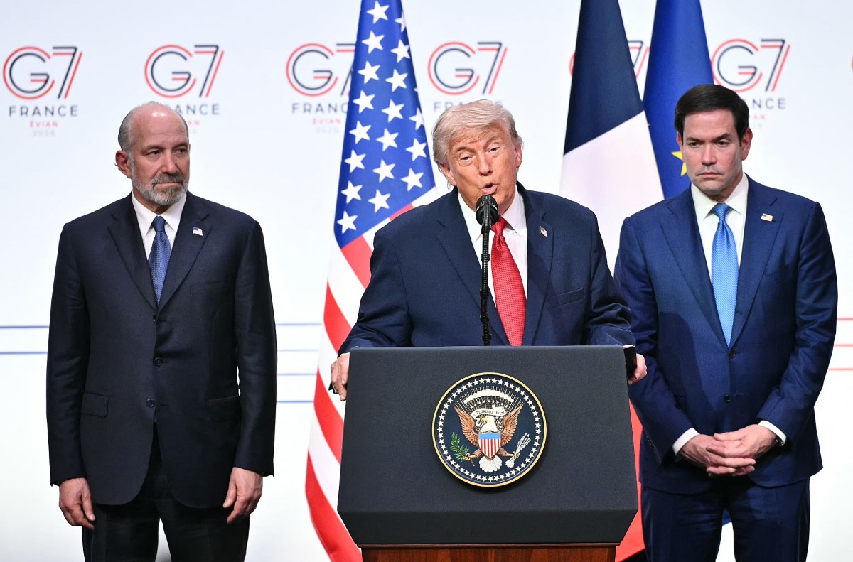U.S. President Donald Trump (C) addresses the media alongside US Secretary of State Marco Rubio (R) and US Commerce secretary Howard Lutnick (L) during a closing press conference at the G7 summit, in Evian, eastern France, on June 17, 2026. Photo: Mandel Ngan / AFP

