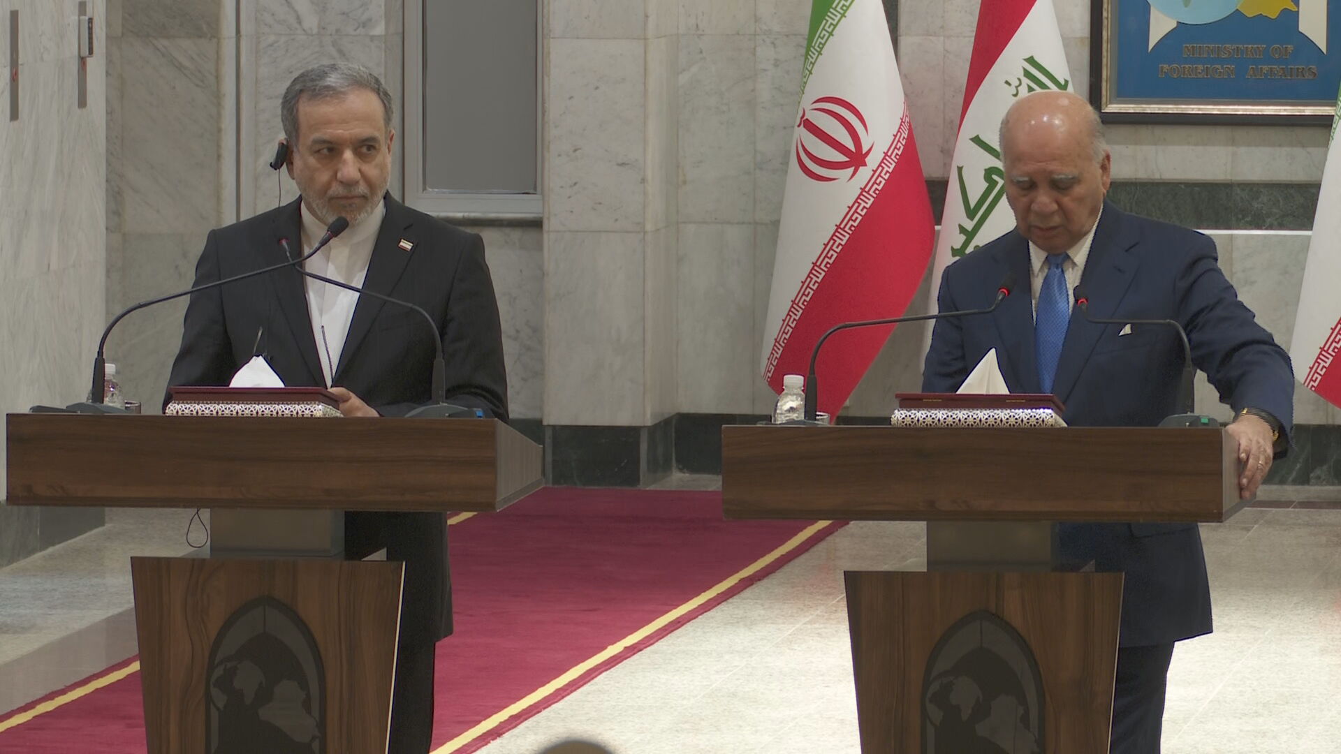 Iraqi Foreign Minister Fuad Hussein and Iranian Foreign Minister Abbas Araghchi speak during a joint press conference in Baghdad on June 28, 2026. 


