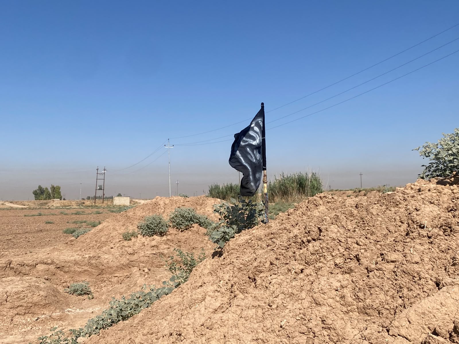An ISIS flag discovered in an agricultural field in Anana village, Daquq