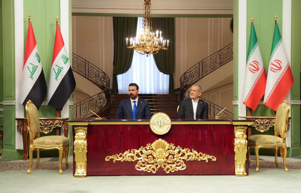 Iraqi Prime Minister ⁠Ali Faleh al-Zaidi and Iranian President Masoud Pezeshkian sign four bilateral agreements in Tehran on July 23, 2026. Photo: Iraqi PM ⁠Media Office 

