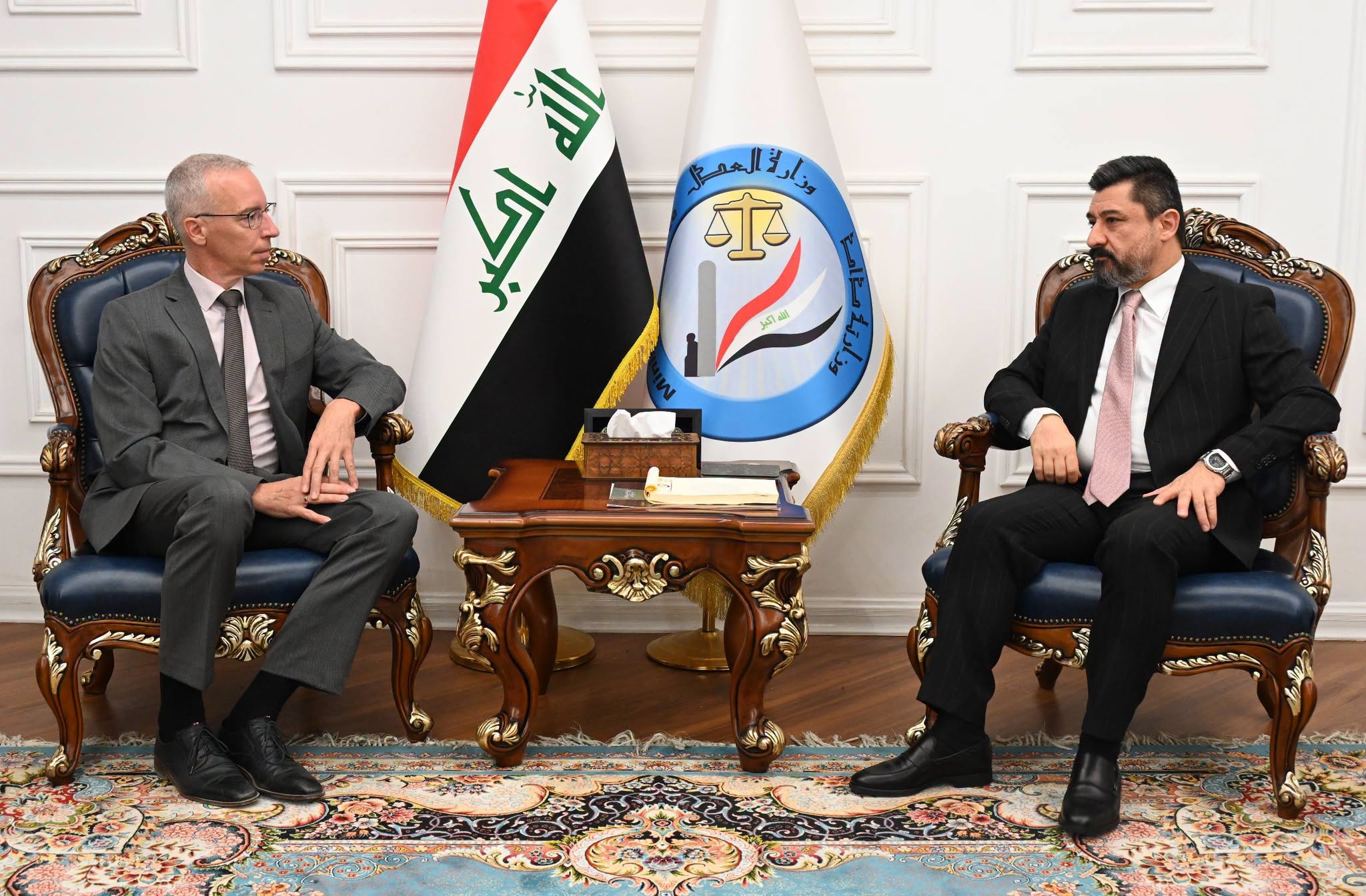 Iraqi Justice Minister Khalid Shwani (right) meets with German Ambassador to Iraq Daniel Kriener in Baghdad to discuss a detainee transfer agreement and judicial cooperation.