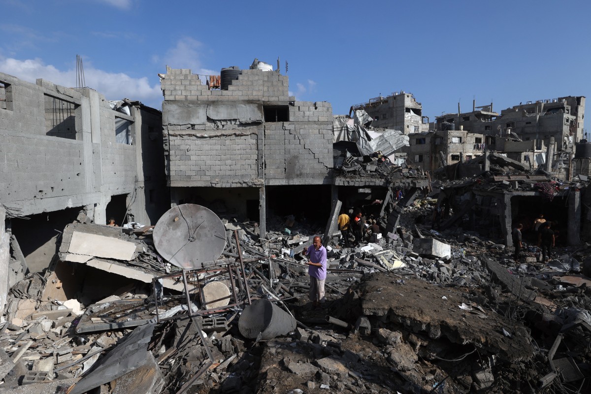 Palestinians inspect the site of an Israeli strike at the Bureij refugee camp in central Gaza Strip, on July 16, 2026.
